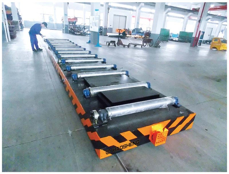 Automatic roller rail transfer cart exchanging pallets with a line