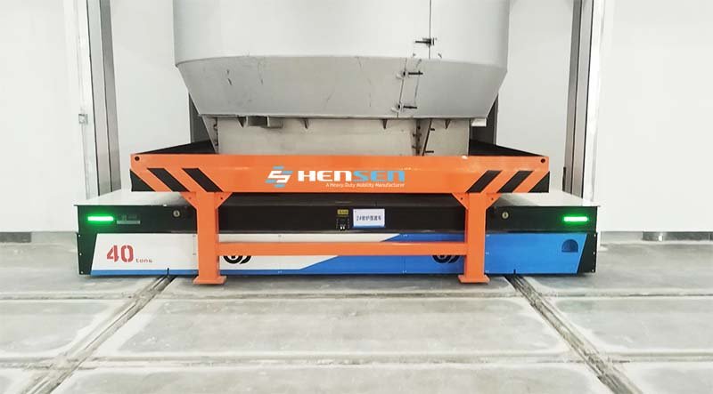 40-ton rail guided vehicle positioned beneath a support frame carrying industrial equipment 